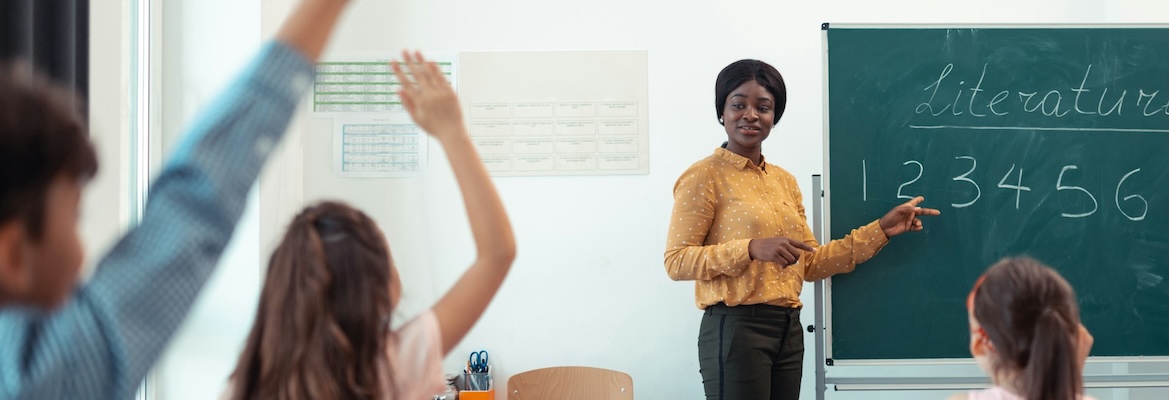 woman standing at the front of the classroom