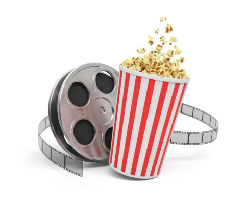 Cup of popcorn and a movie reel