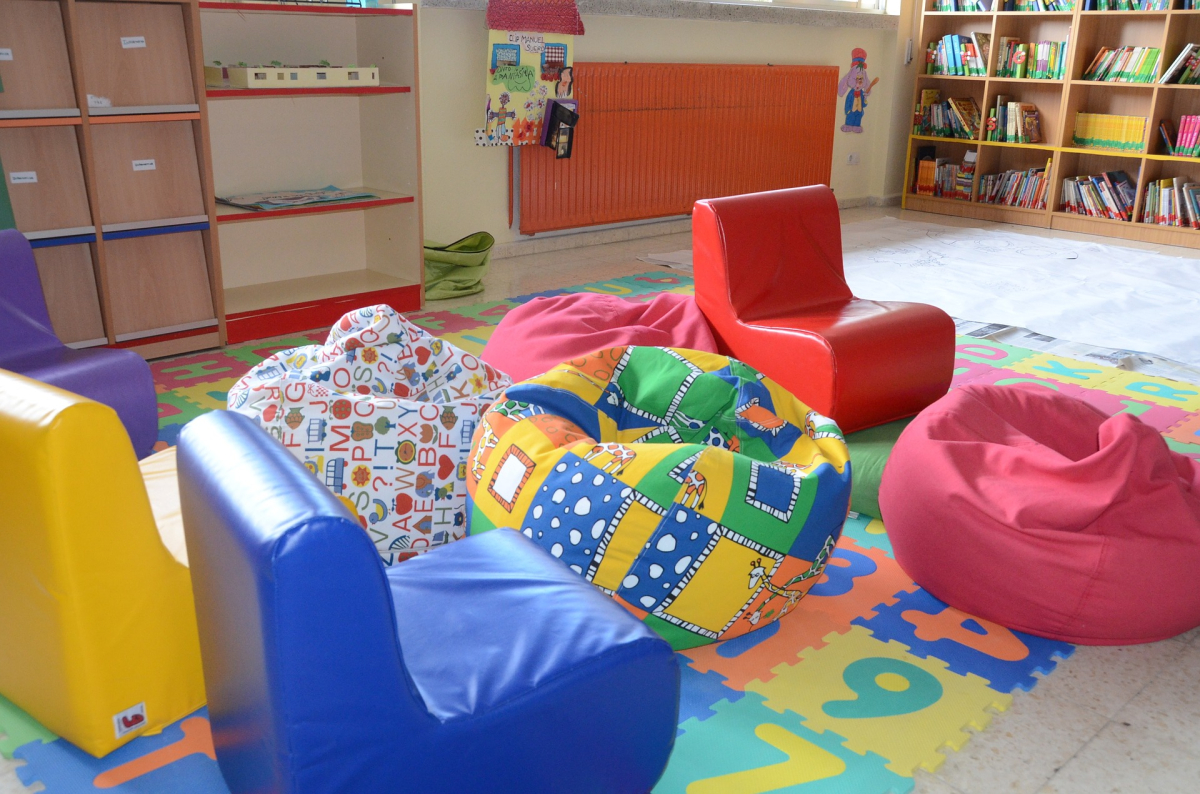 children's room with beanbags and colorful rug