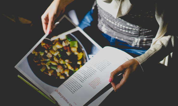 person reading cookbook