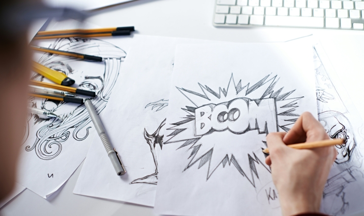 person drawing comic illustration