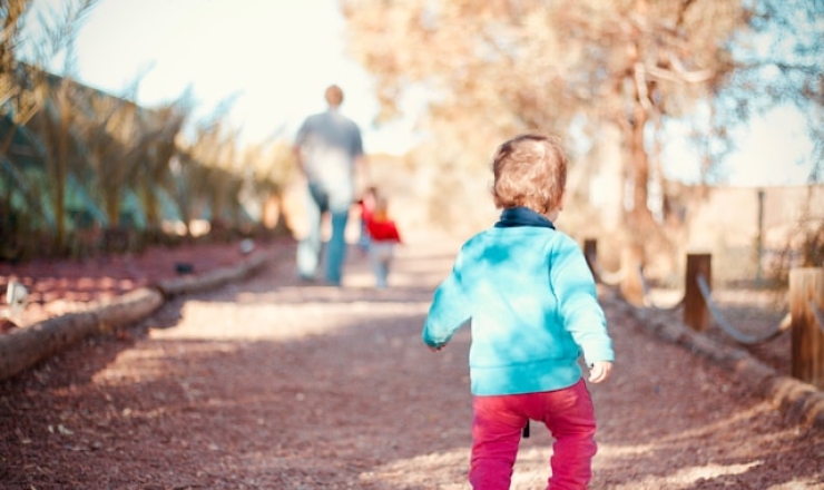 Small child walking on trail